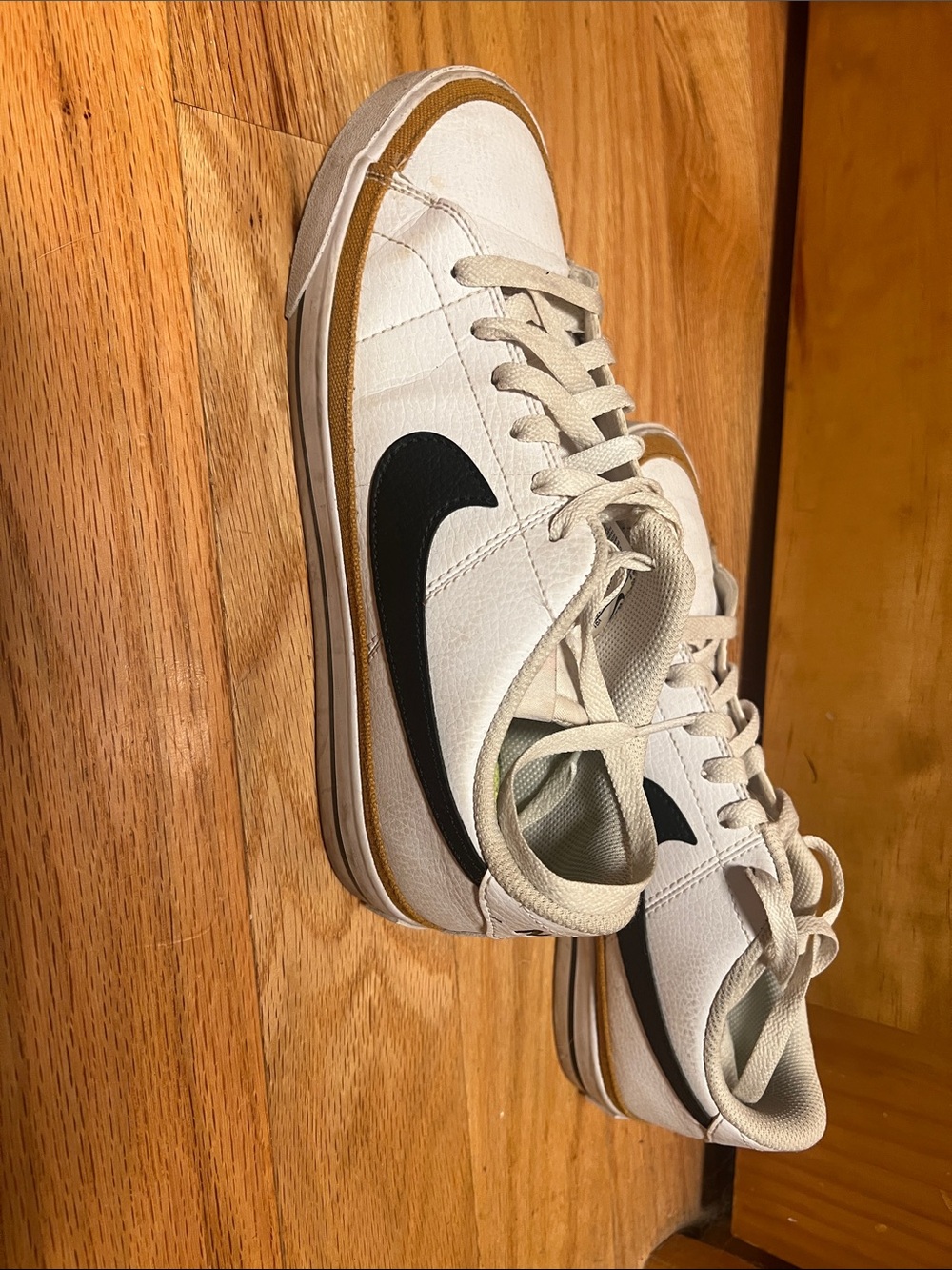 Nike Cream White Low-Top Sneakers with Black Swoosh and Tan Accent